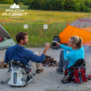 Couple Camping Sitting in Summit Packs