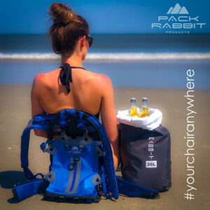 Girl sitting blue backpack seat on the beach