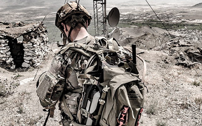 Soldier wearing tan backpack in Afghanistan